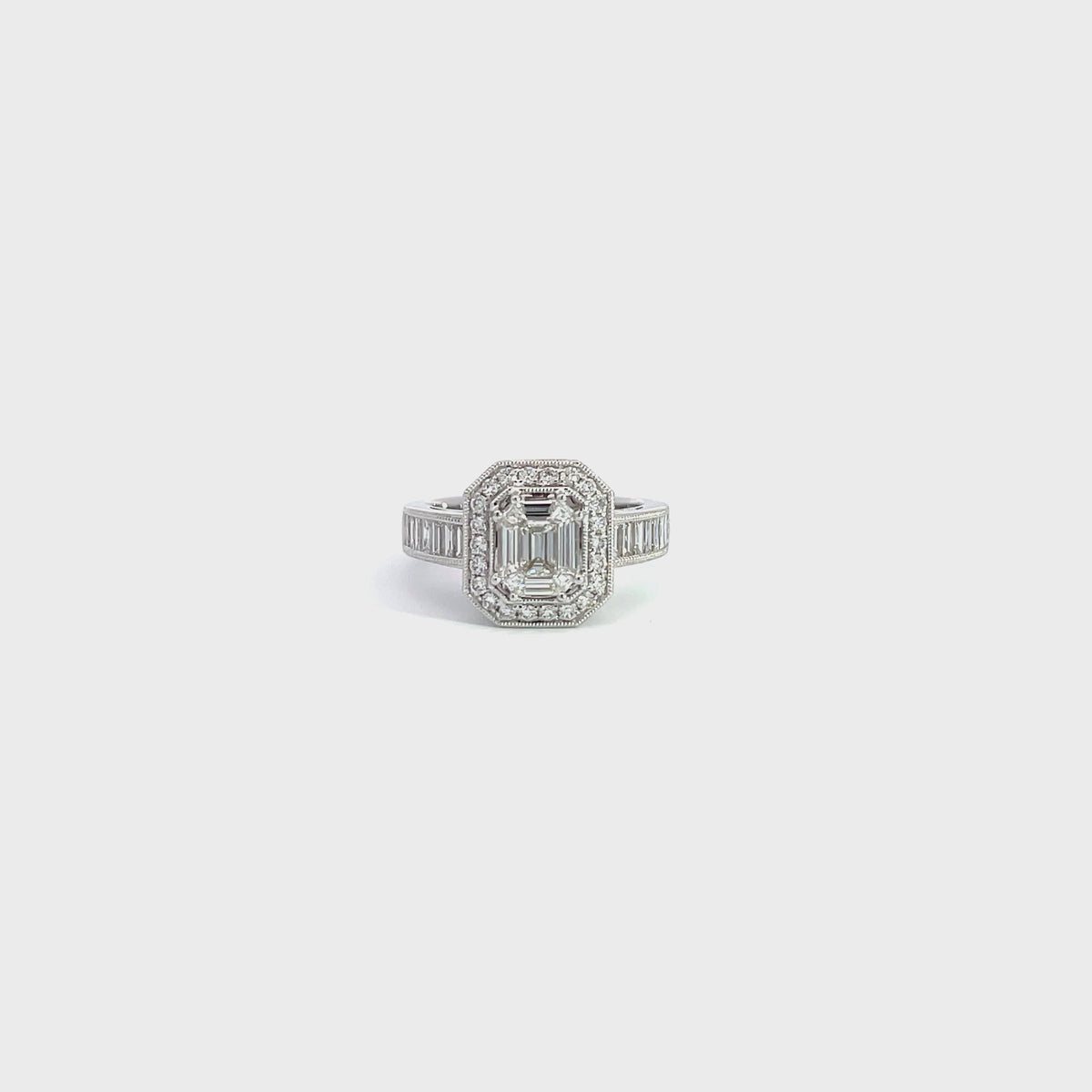 18K White Gold Art Deco Inspired Emerald Cut Diamond Ring with Diamond Halo and Baguette Cut Side Stones